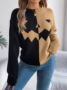 Women's knit pullover by Lumina Wear featuring bold orange and black colors with a Jack-o'-Lantern design.