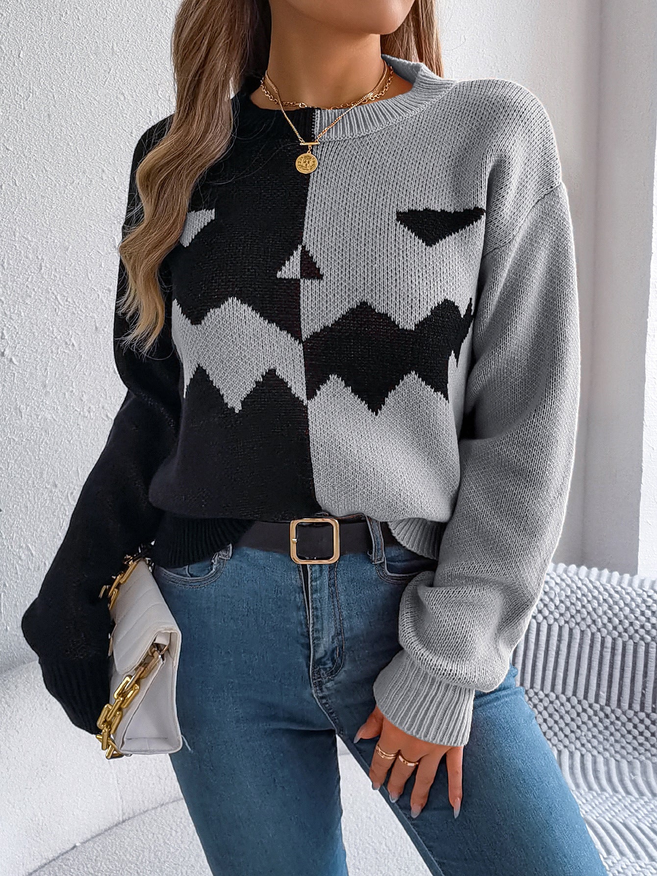 Lumina Wear women's knit pullover named Isabella in bold orange and black with a Jack-o'-Lantern design, cozy sweater for fall.
