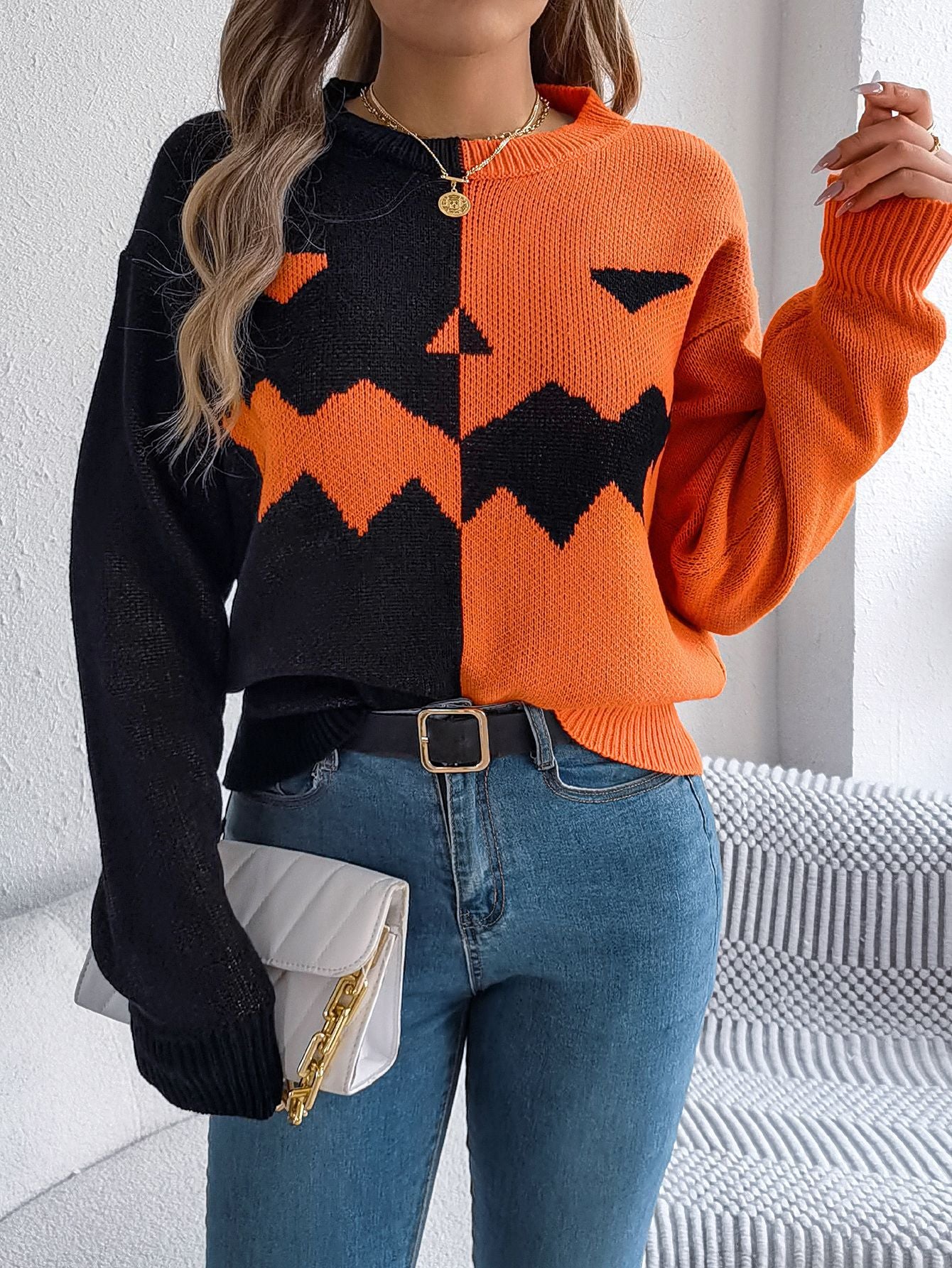 Lumina Wear Isabella women's knit pullover with bold orange and black Jack-o'-Lantern design, cozy Halloween-themed sweater.