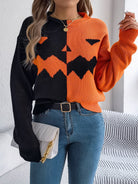 Lumina Wear Isabella women's knit pullover with bold orange and black Jack-o'-Lantern design, cozy Halloween-themed sweater.