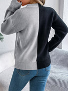 Lumina Wear Isabella women's knit pullover featuring bold orange and black Jack-o'-Lantern design, cozy Halloween-themed sweater.