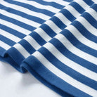 Lumina Wear Isabella bold striped relaxed fit sweater with ribbed neckline, featuring vibrant horizontal stripes and cozy knit fabric.