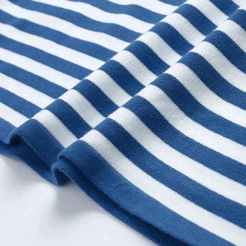 Lumina Wear Isabella bold striped relaxed fit sweater with ribbed neckline, featuring vibrant horizontal stripes and cozy knit fabric.