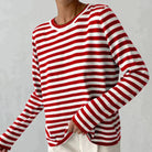 Lumina Wear Isabella bold striped relaxed fit sweater featuring a ribbed neckline and comfortable, casual style.
