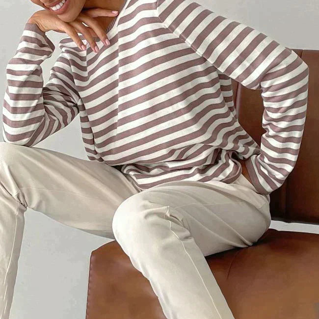 Lumina Wear Isabella bold striped relaxed fit sweater with ribbed neckline, featuring vibrant horizontal stripes and cozy knit fabric.