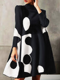 Chic polka-dot A-line mini dress with mock neck by Lumina Wear, featuring a stylish fit and classic pattern.