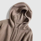 Lumina Wear Isabella cozy hooded thick knit sweater with a loose fit, shown in a soft, textured fabric.
