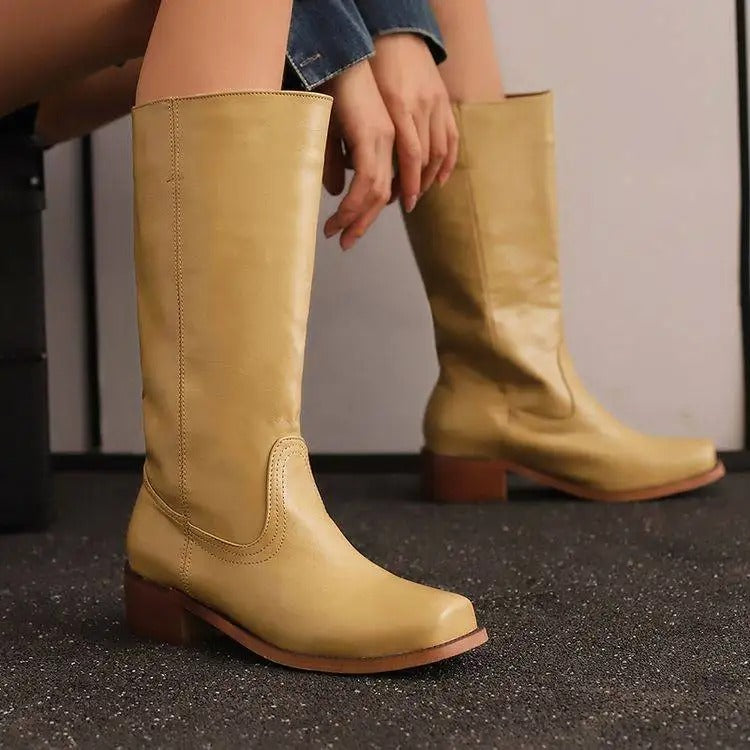 Black knee-high boots with stacked heel from Lumina Wear, featuring a sleek, elegant design perfect for women's fashion.