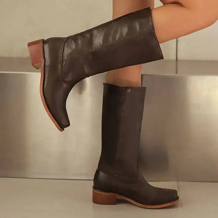 Elegant black knee-high boots with stacked heel from Lumina Wear, featuring sleek leather and stylish design.