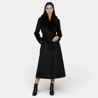 Elegant long wool coat with a fur collar from Lumina Wear, modeled by Isabella, showcasing sophisticated winter outerwear.