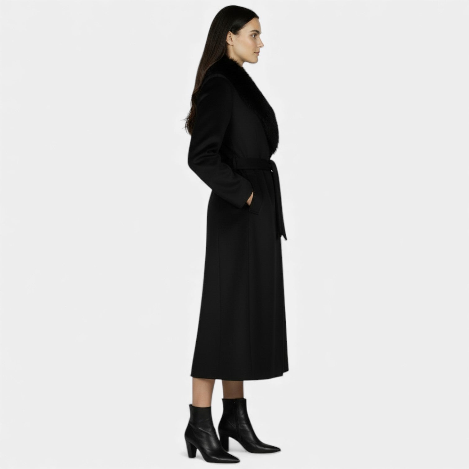 Elegant women's long wool coat with fur collar by Lumina Wear, showcased in a stylish, tailored design for winter elegance.