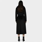 Elegant long wool coat with fur collar from Lumina Wear, featuring a tailored fit and luxurious fabric for women.