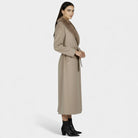 Elegant women’s long wool coat with fur collar by Lumina Wear, featuring a sophisticated design and plush fur detailing.