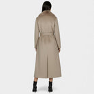 Elegant long wool coat with fur collar from Lumina Wear, featuring a tailored design and luxurious detailing for women.