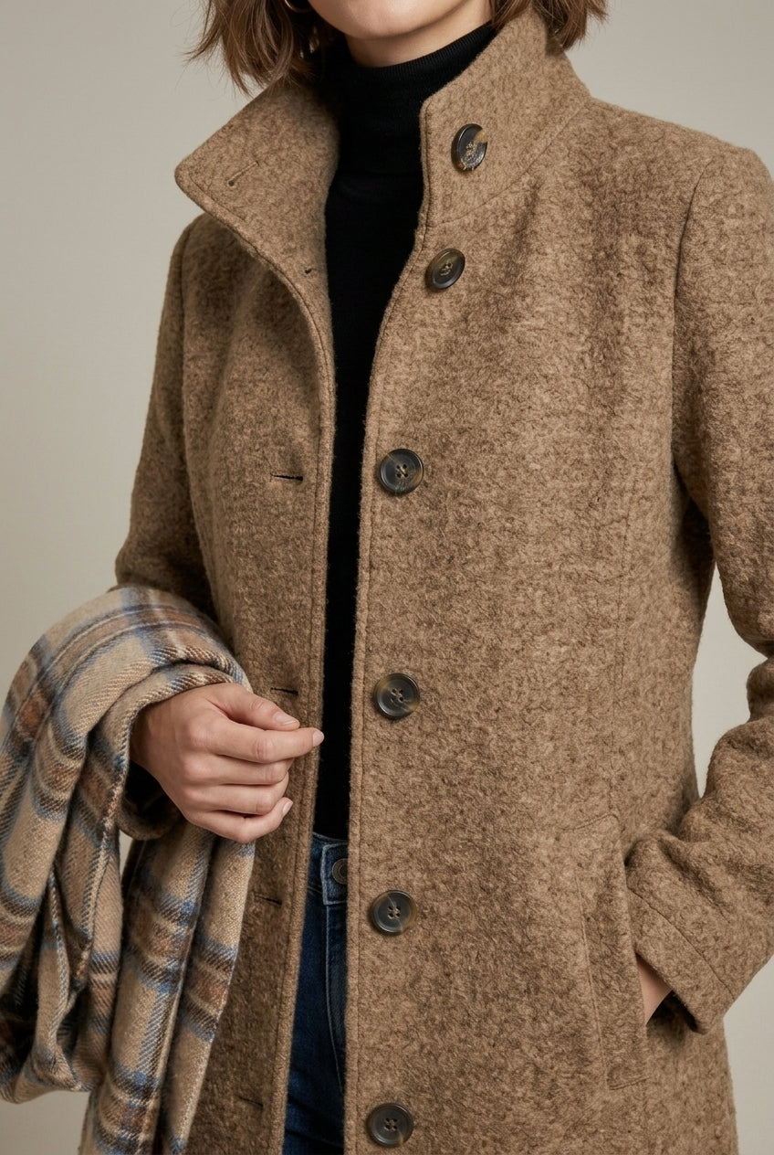 Elegant women's mid-length wool coat with notch collar and button front by Lumina Wear, shown in a classic style.