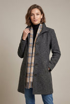 Elegant mid-length wool coat with notch collar and button front by Lumina Wear, stylish women's outerwear in a sophisticated design.