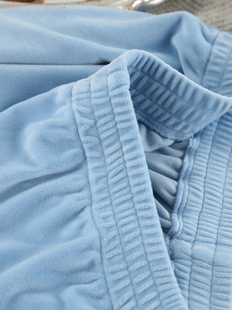 Light blue Solange pajama set with elegant notch collar and wide-leg pants from Lumina Wear, perfect for comfortable sleepwear.