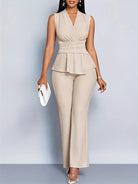 Elegant women's two-piece pants set featuring a peplum top and flowing trousers by Lumina Wear, perfect for stylish occasions.