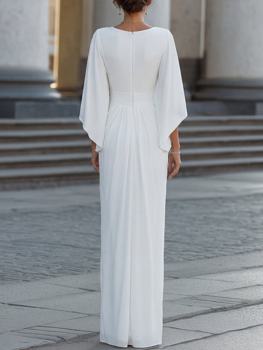 Elegant pleated maxi dress with cape sleeves by Lumina Wear, featuring flowing fabric and sophisticated design.