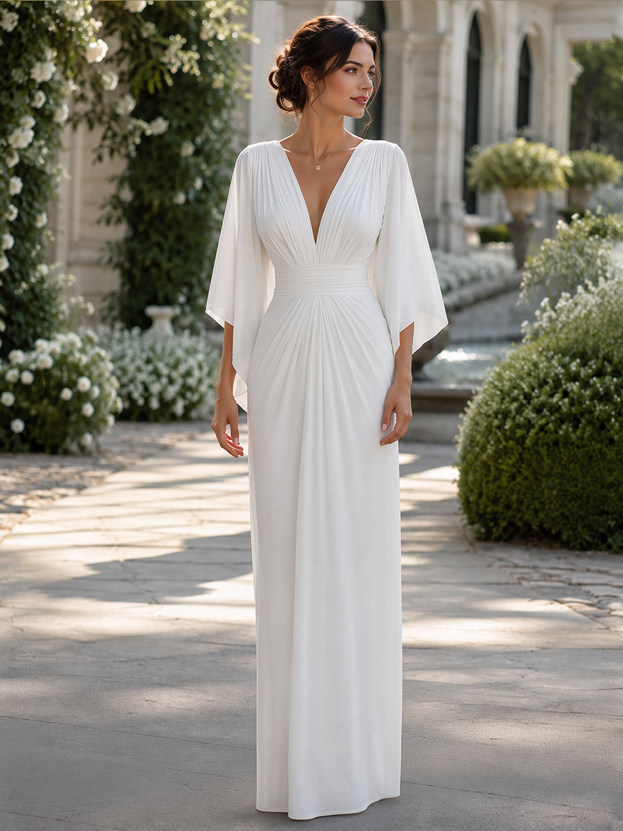 Isabella Lumina Wear elegant pleated maxi dress with cape sleeves, flowing fabric and sophisticated design for formal occasions.