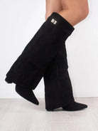 Black knee-high women's boots with pointed toes and side zipper from Lumina Wear, featuring an elegant and sleek design.