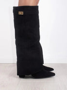 Black knee-high boots for women by Lumina Wear featuring pointed toes and side zippers, stylish and elegant footwear.