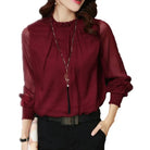 Lumina Wear Isabella elegant ruffle blouse with flowing sleeves, styled for a sophisticated look.