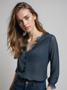 Lumina Wear Isabella elegant ruffle blouse with graceful sleeves, featuring delicate fabric and stylish design.