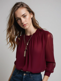 Lumina Wear Isabella elegant ruffle blouse with graceful sleeves, showcasing stylish details and lightweight fabric.