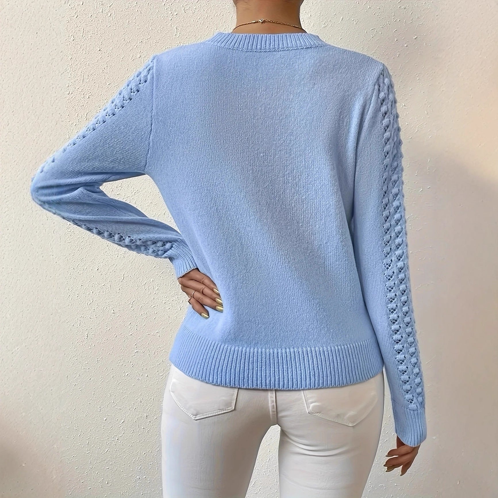 Lumina Wear Isabella fitted pointelle knit jumper with puff shoulders, showcasing a stylish, cozy sweater with textured pattern.