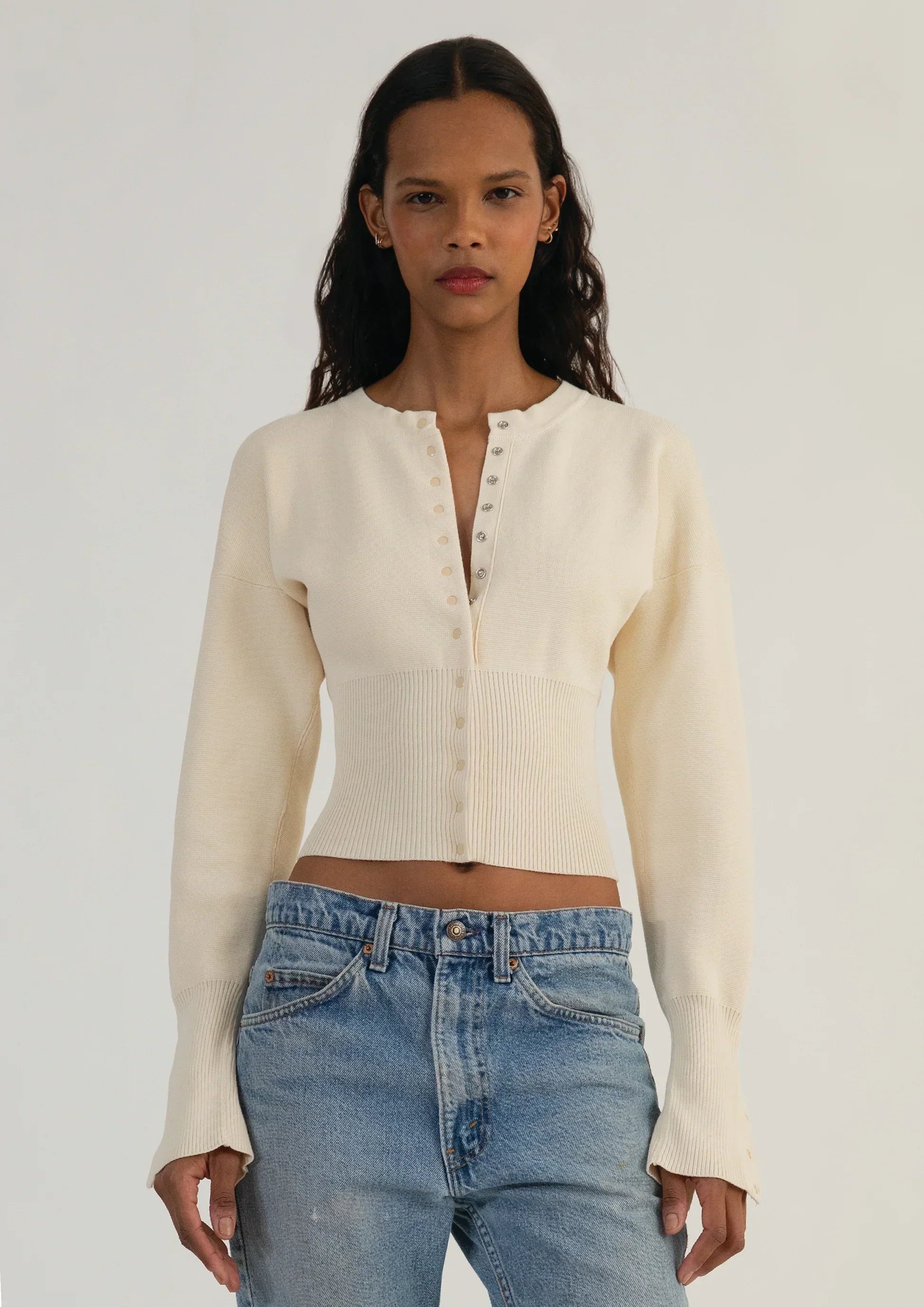 Fitted ribbed cropped women's cardigan with button closure from Lumina Wear, featuring a stylish and snug design.