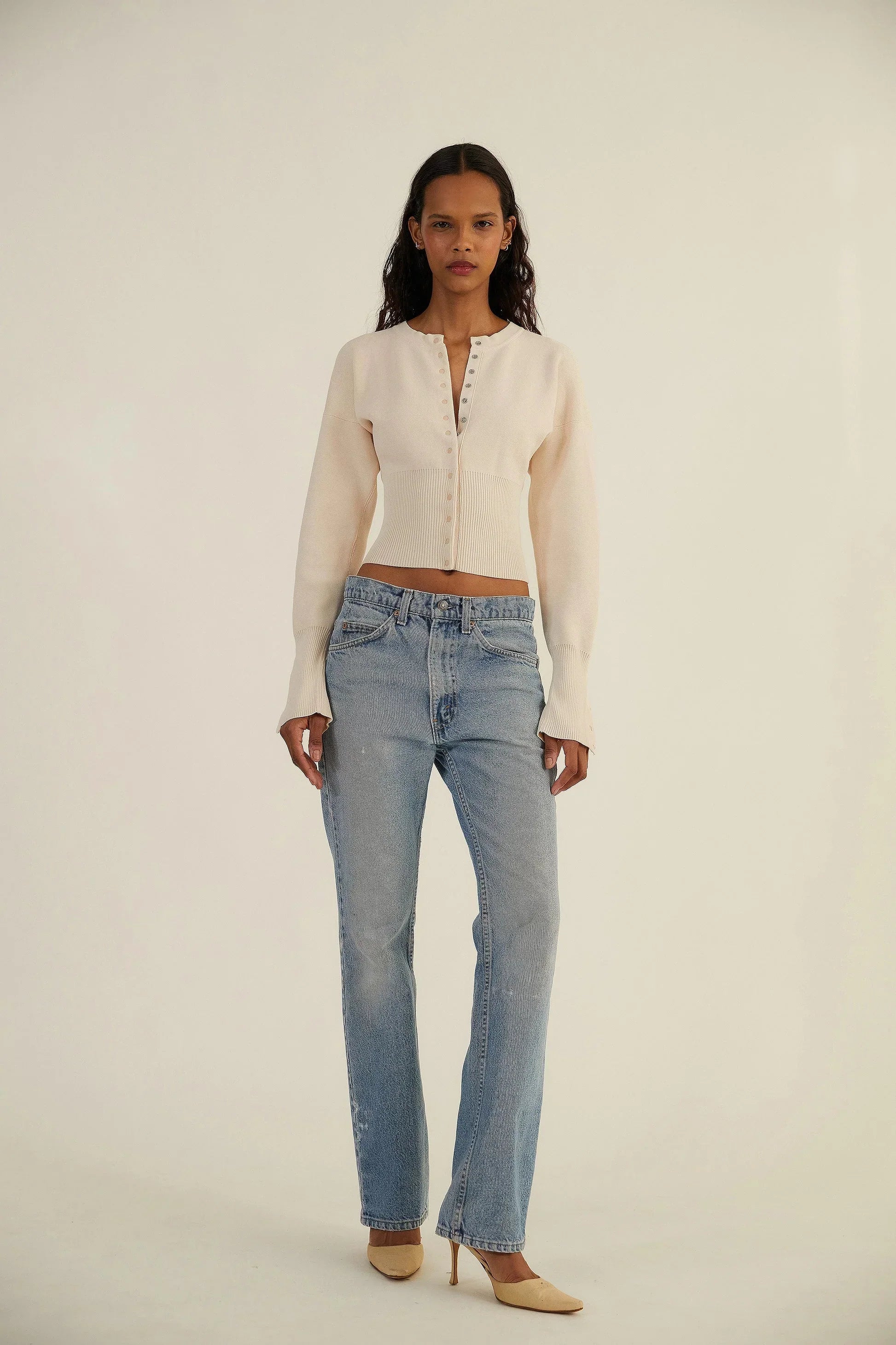 Fitted ribbed cropped cardigan with button closure from Lumina Wear, styled on a woman, in a neutral color.