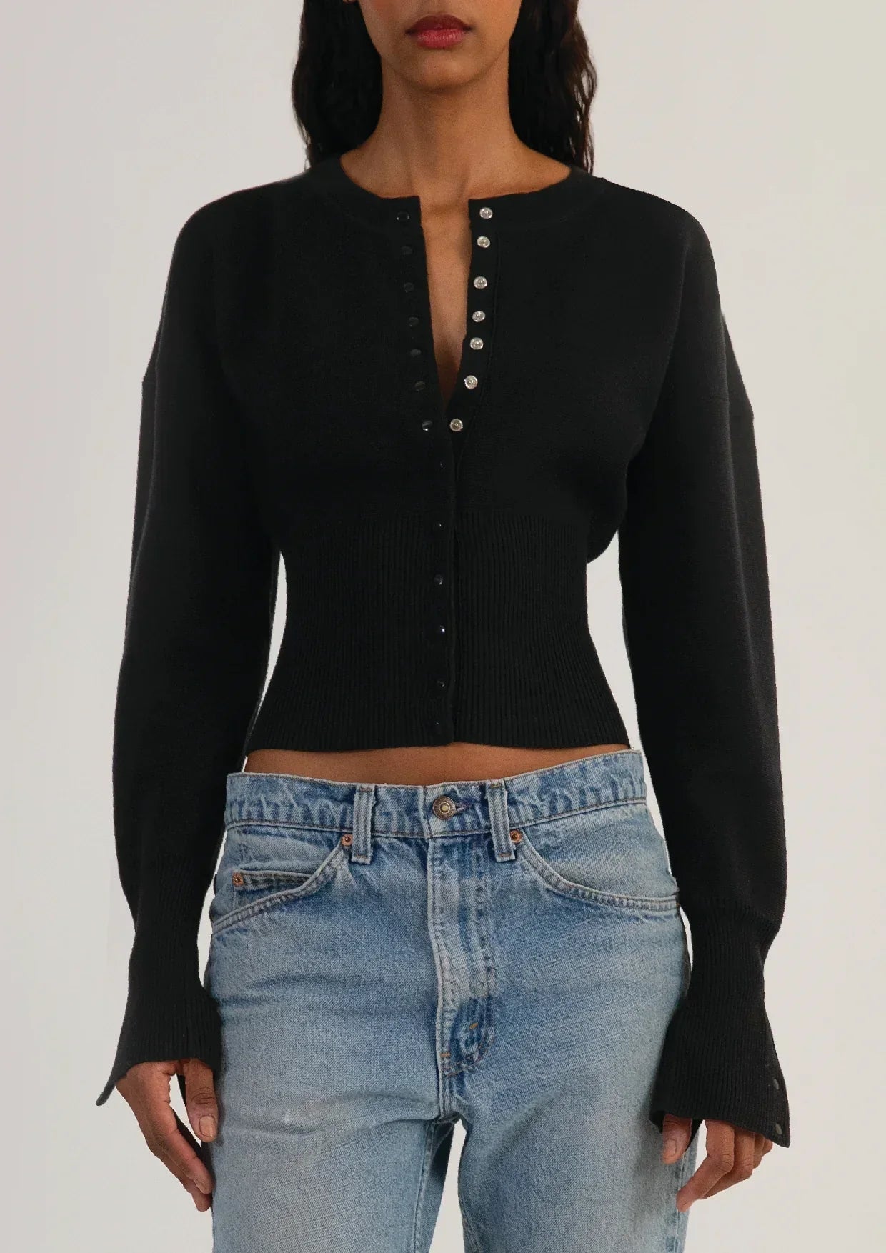 Fitted ribbed cropped cardigan with button closure in soft fabric, designed for women by Lumina Wear.