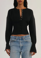 Fitted ribbed cropped cardigan with button closure in soft fabric, designed for women by Lumina Wear.