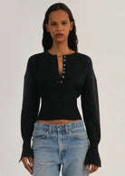 Lumina Wear Isabella fitted ribbed cropped cardigan with button closure, showcasing a close-up of the stylish women's cardigan.