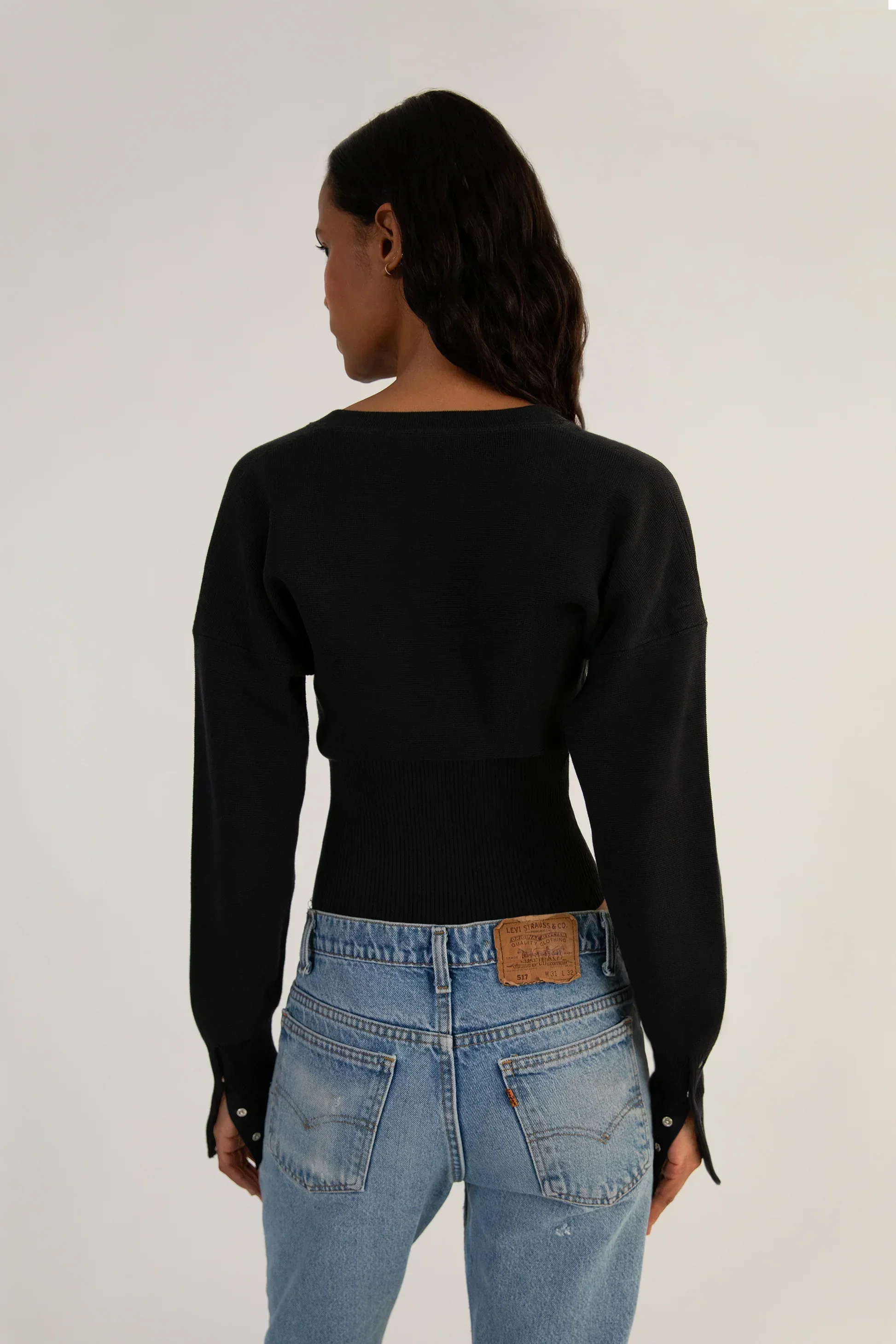 Fitted ribbed cropped cardigan with button closure by Lumina Wear, featuring a stylish, snug fit and textured knit fabric.