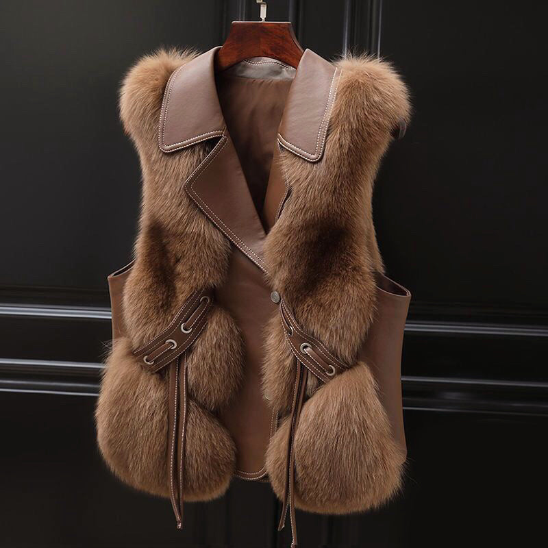 Lumina Wear Isabella fluffy vest with lapel collar, waist tie, and faux fur trim, shown on a model.