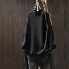 Lumina Wear Isabella high-neck textured knit sweater with a relaxed fit, showcasing cozy fabric and stylish design.