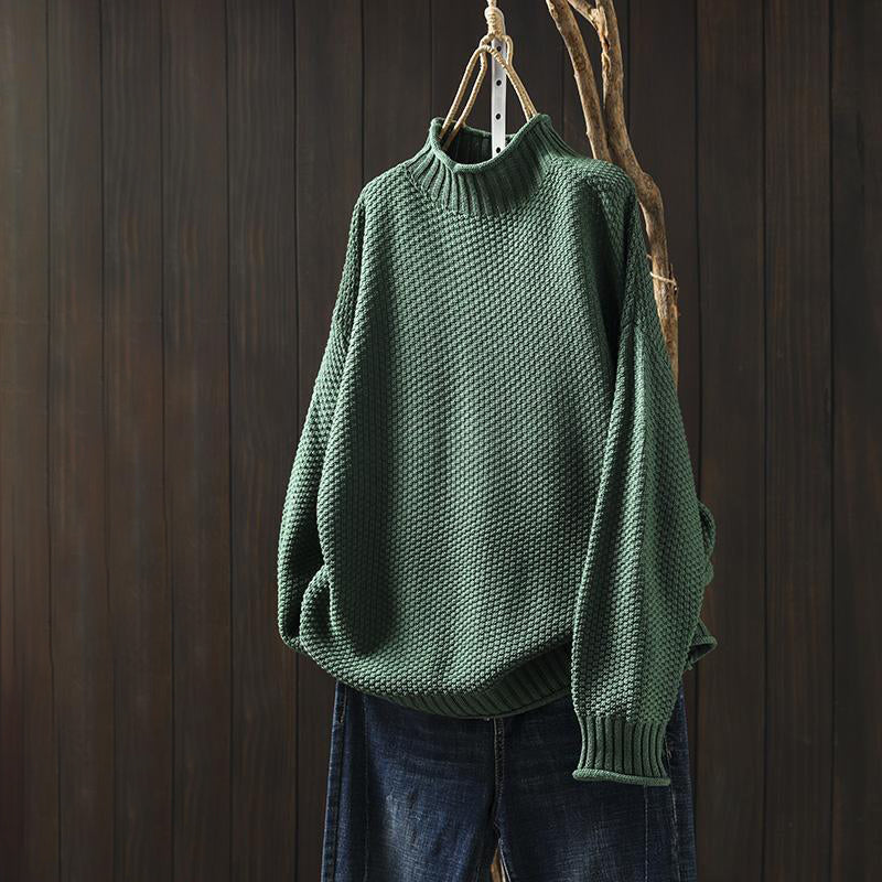 Isabella Lumina Wear high-neck textured knit relaxed fit sweater displayed in a cozy, stylish look with detailed fabric texture.