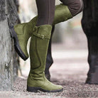Women's knee-high buckle strap boots with ridged sole by Lumina Wear, featuring stylish buckles and durable traction.