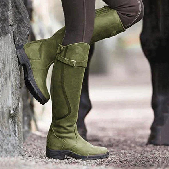 Women's knee-high buckle strap boots with ridged sole by Lumina Wear, featuring stylish buckles and durable traction.