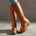 Isabella Lumina knee-high buckle strap boots with side zipper, stylish black leather footwear for women.