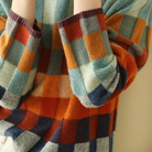 Multi-color checked relaxed fit women's sweater with mock neck by Lumina Wear, featuring a cozy, stylish design.
