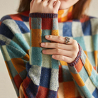 Multi-color checked relaxed fit sweater with mock neck for women, by Lumina Wear, styled on a model with long sleeves.
