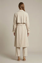 Isabella Lumina black oversized trench coat with structured lapels, long sleeves, and a classic silhouette for a stylish look.