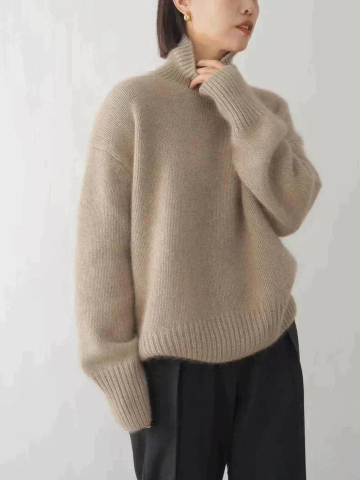 Lumina Wear Isabella oversized black turtleneck sweater with relaxed fit, shown on a model, highlighting cozy knit fabric and stylish design.