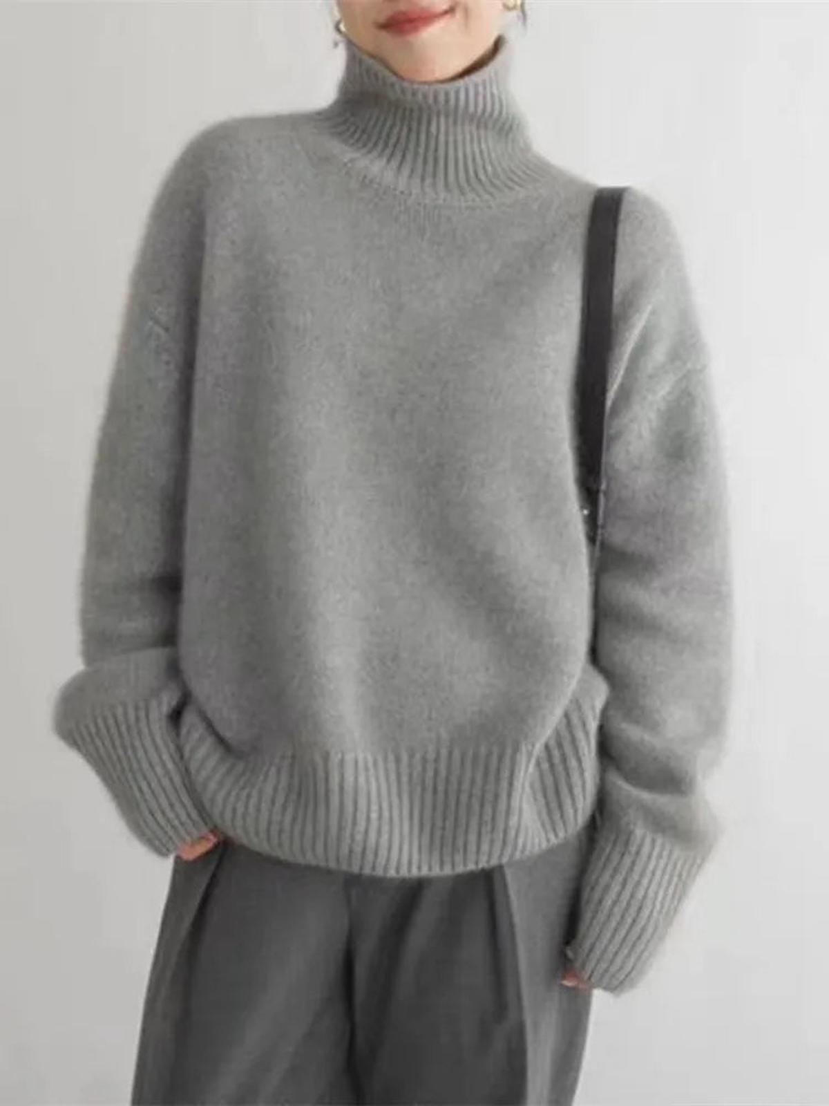 Black oversized turtleneck sweater by Lumina Wear featuring a relaxed fit, styled on a model.