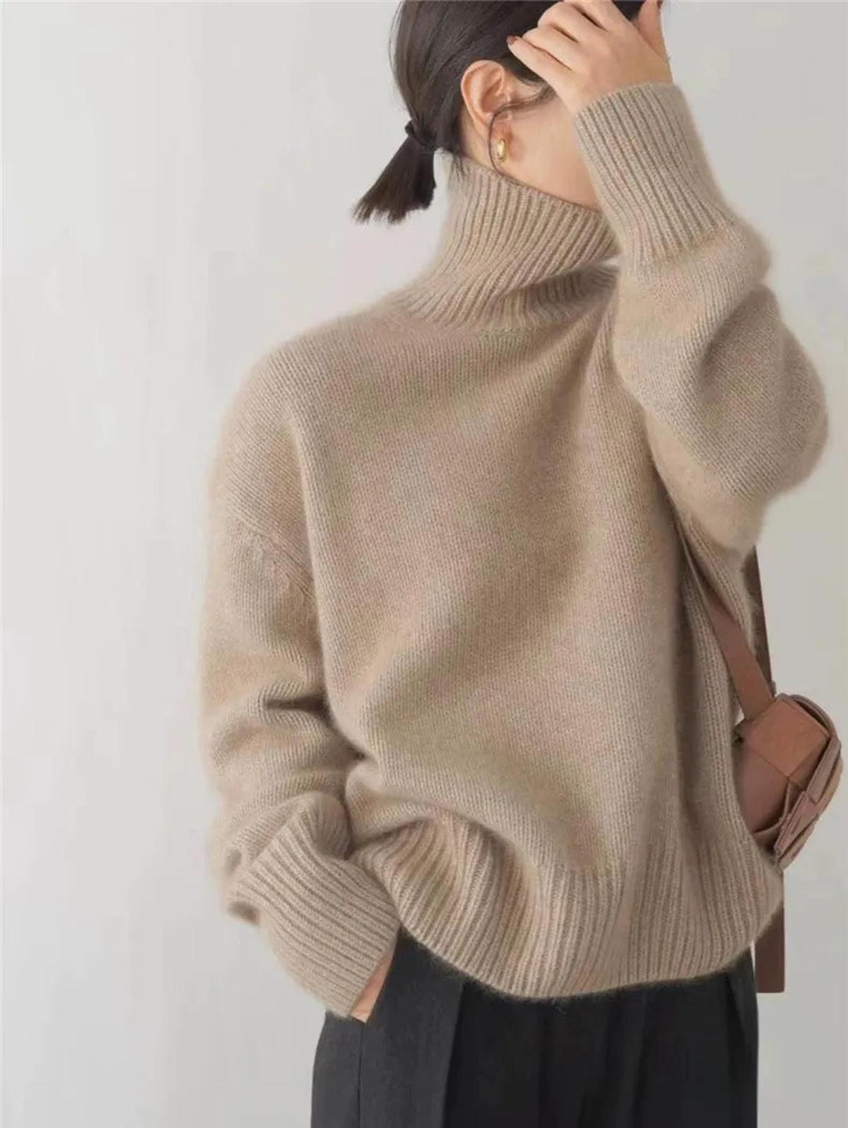 Black oversized turtleneck sweater by Lumina Wear featuring a relaxed fit and cozy style, displayed on a model.