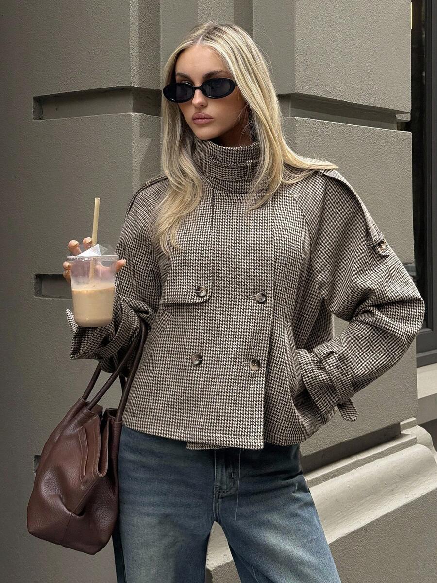 Oversized houndstooth blazer with funnel neck and double-breasted front by Lumina Wear, styled on a woman.