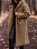 Lumina Wear Isabella oversized plush teddy fleece winter coat with notched lapel, shown on a hanger.